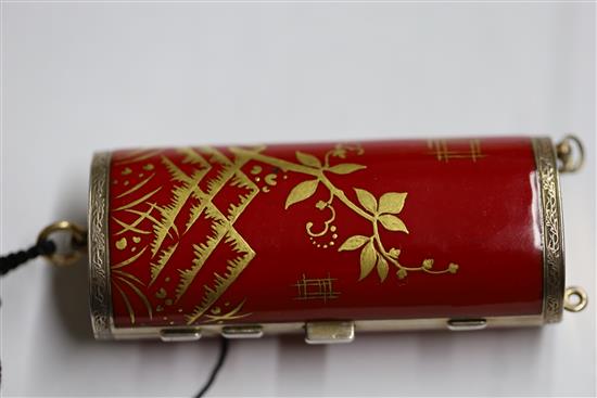 A ladys 1920s silver gilt and gilded red enamelled ovoid minaudiere, import marks for Cohen & Charles, London, 1925, 82mm.